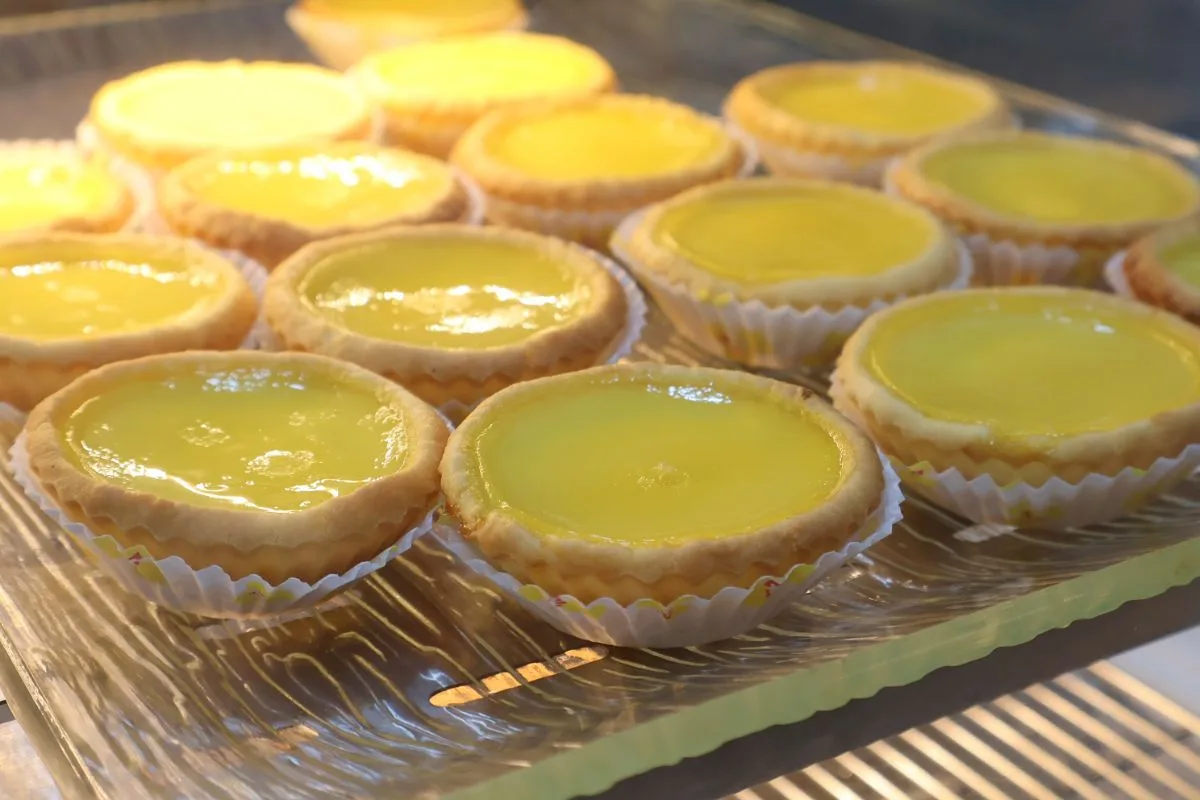 A tray of 126 Dim Sum&rsquo;s freshly baked egg tarts
